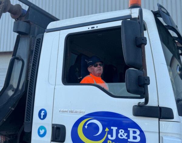 Close up of driver in J&B Recycling truck