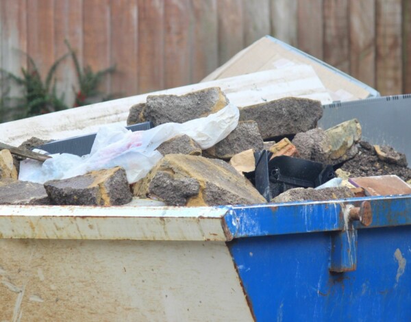 Blue skip containing rubble