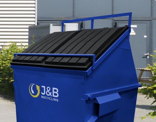 Blue front-end loader skip with J&B recycling logo