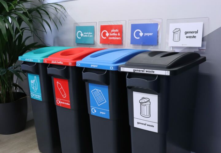Photo of plastic indoor recycling bins to segregate business waste including general waste, paper, plastic and glass