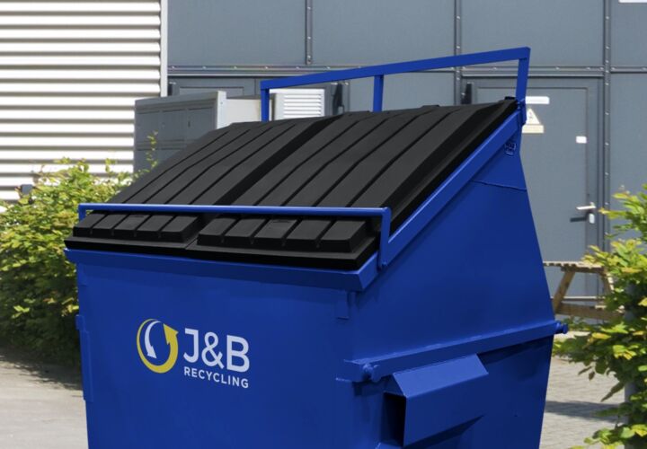 Blue front-end loader skip with J&B recycling logo