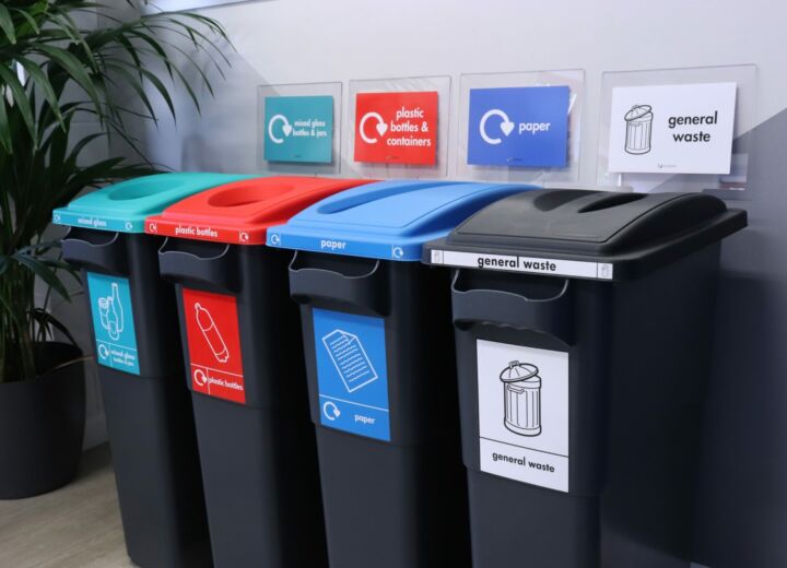 Photo of plastic indoor recycling bins to segregate business waste including general waste, paper, plastic and glass
