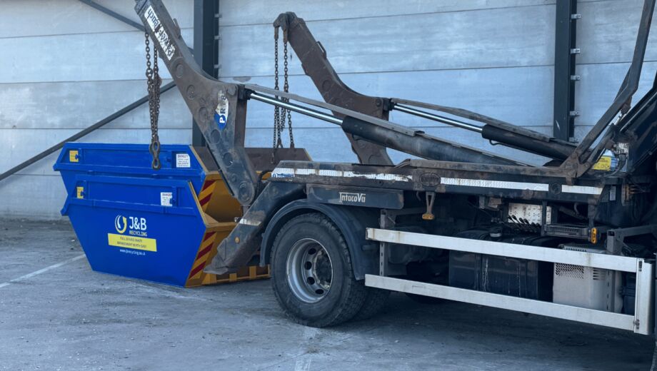 Truck delivering commercial skips