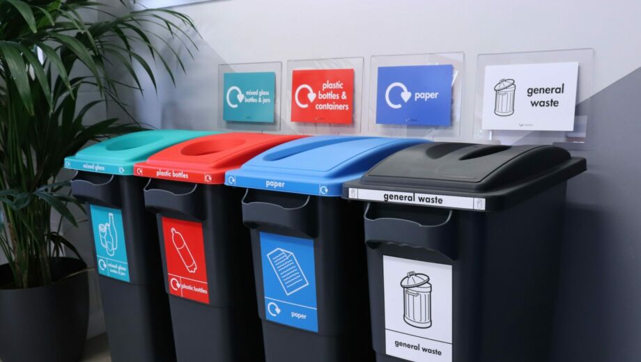 Photo of plastic indoor recycling bins to segregate business waste including general waste, paper, plastic and glass