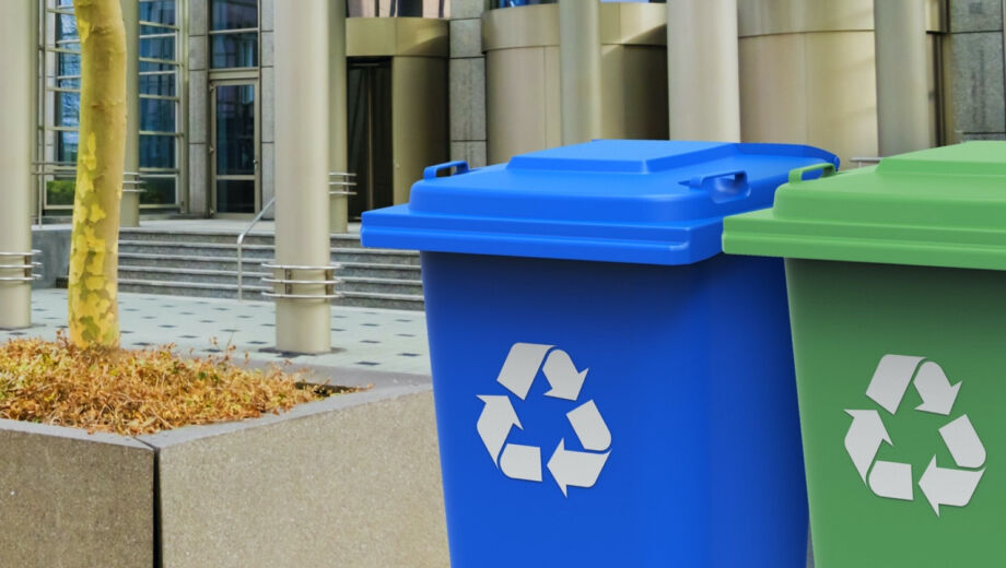 Blue and green wheelie bins for dry mixed recyclables such as cardboard, paper and plastic